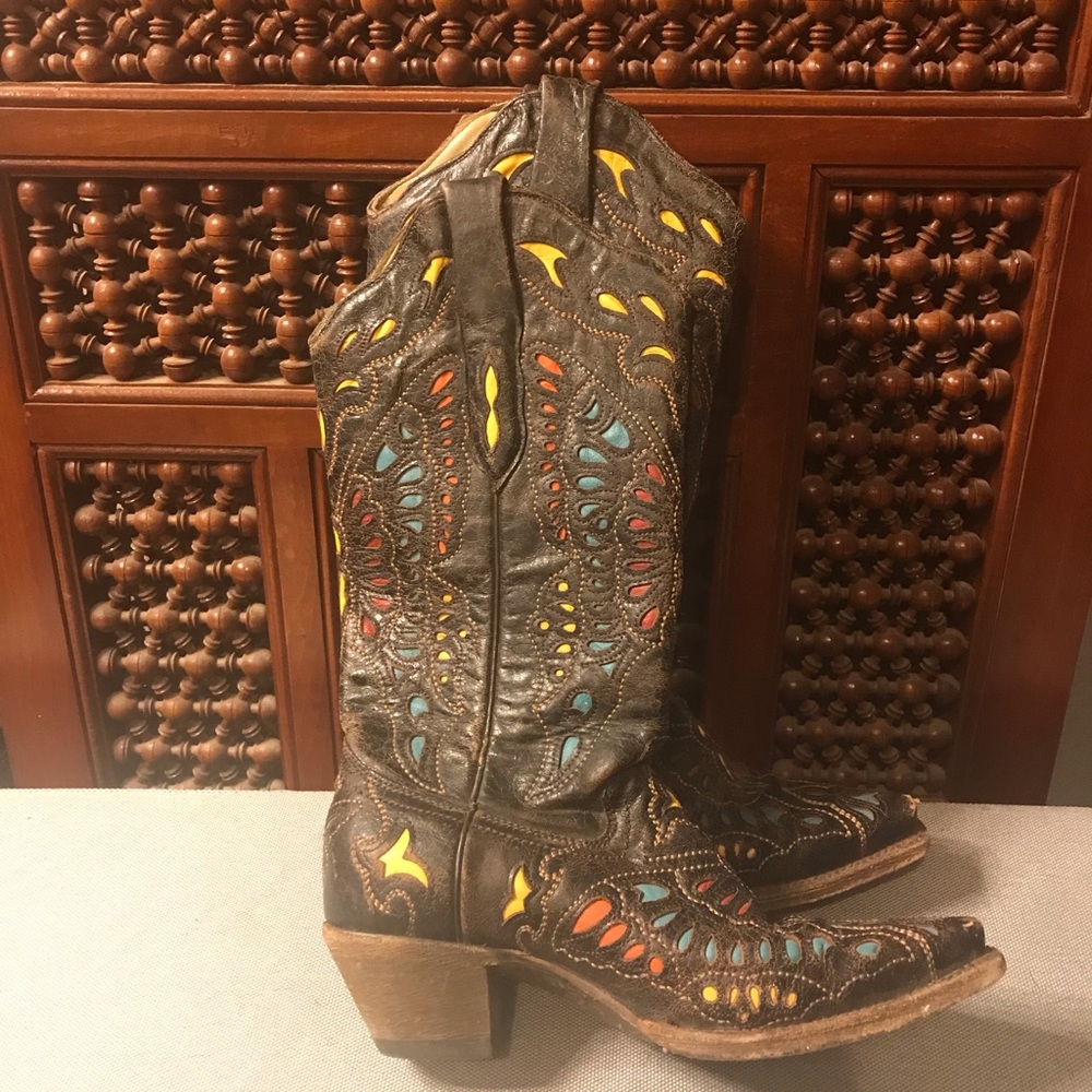 Multicolored cowboy boots with a butterfly motif.